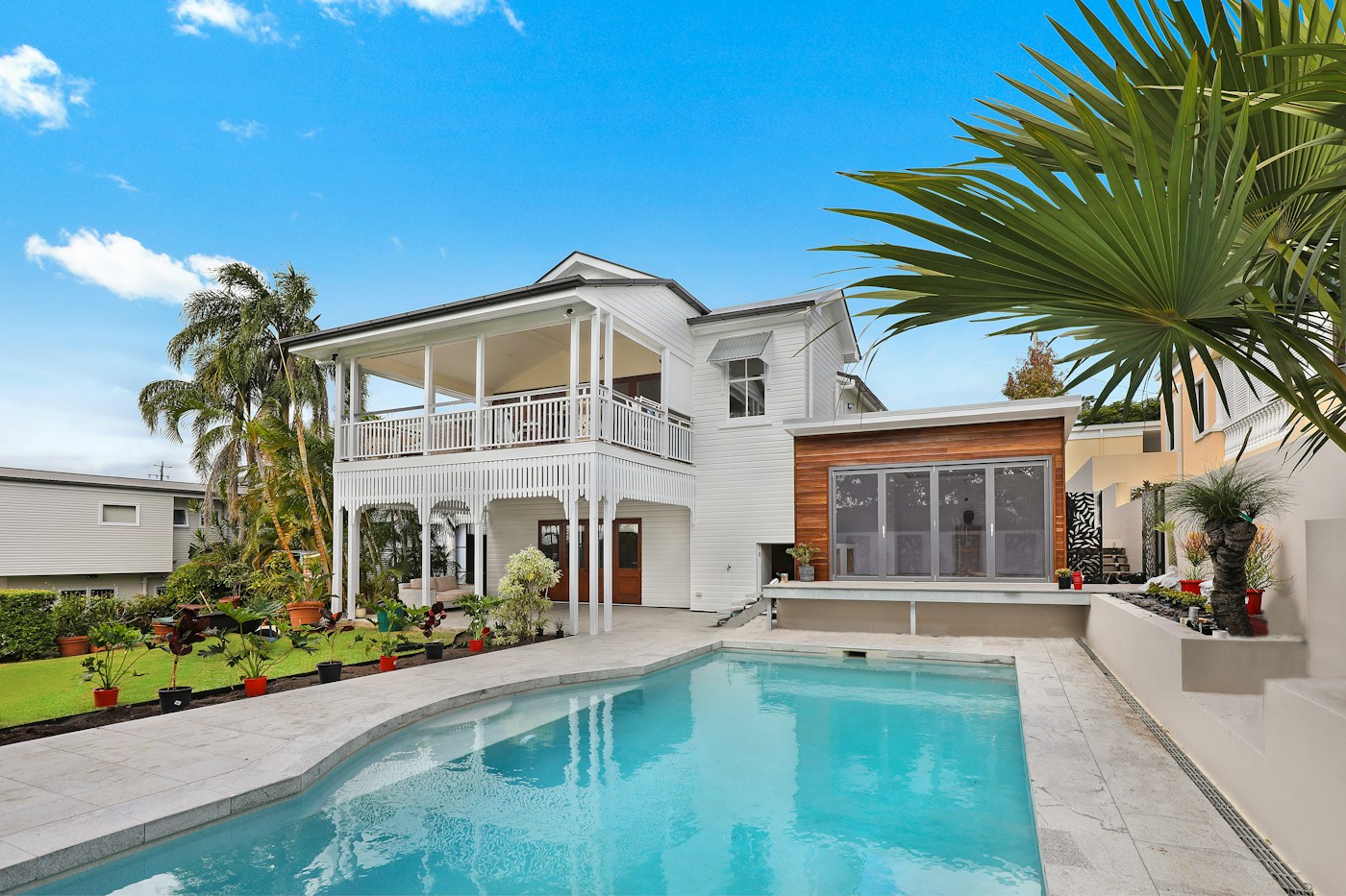 Bright coastal house exterior with fresh white finishes
